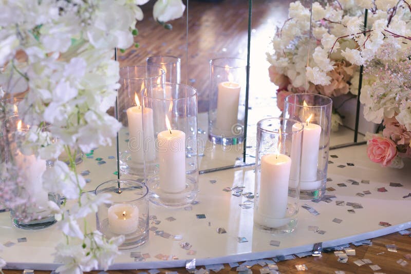 Wedding Decor in a Restaurant with Candles and Flowers. Stock Photo
