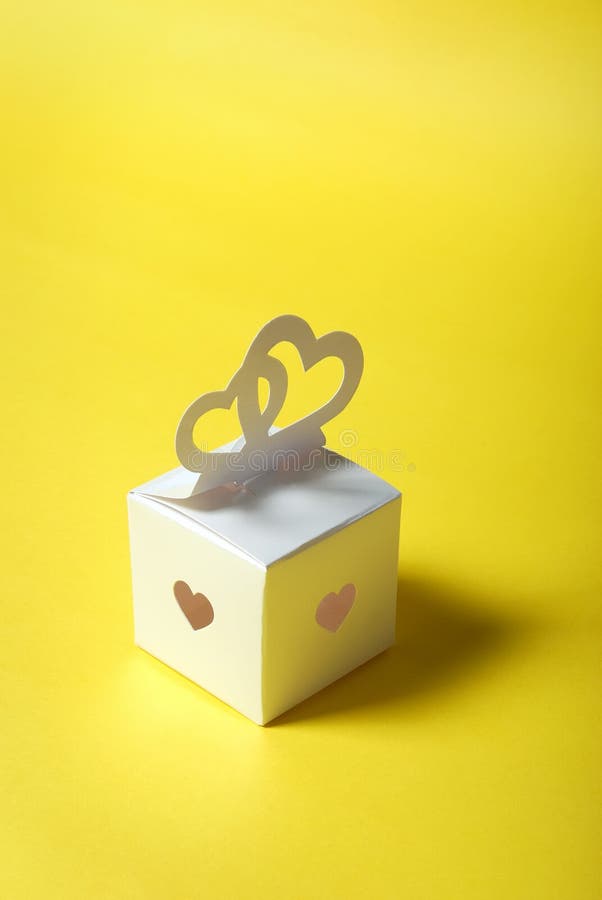Wedding gift. Elegance romantic hearts-symbol on a yellow background. Wedding gift. Elegance romantic hearts-symbol on a yellow background