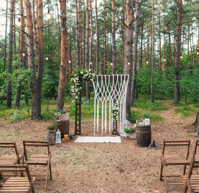 Wedding decoration in the garden. Modern wedding. Wedding in the wood. Wedding arch stock photos Wedding decoration in the garden. Modern wedding. Wedding in the wood. Wedding arch stock photos