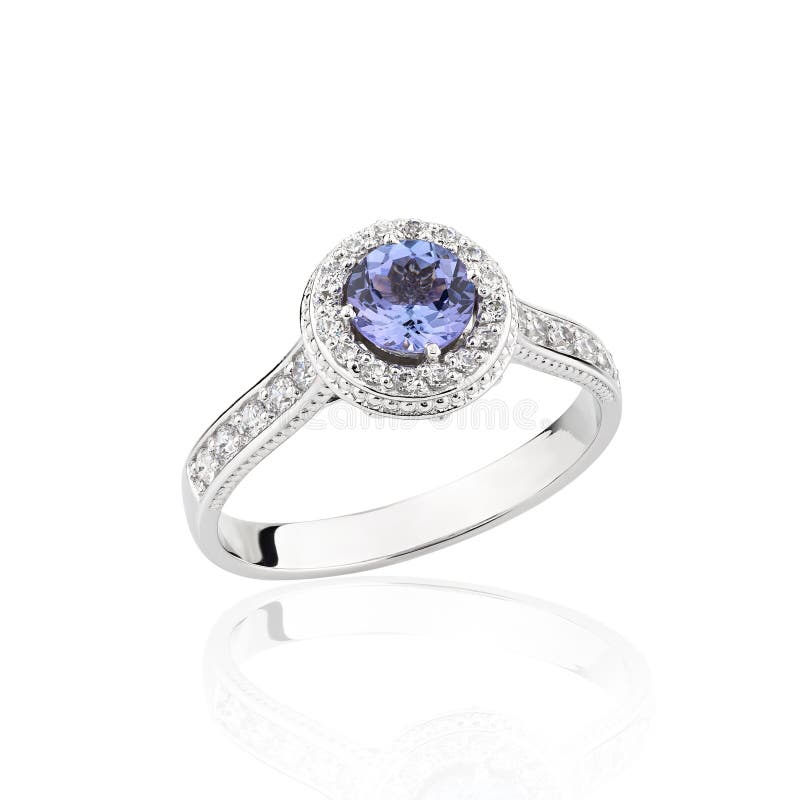 Wedding diamond ring with blue gemstone isolated on a white background