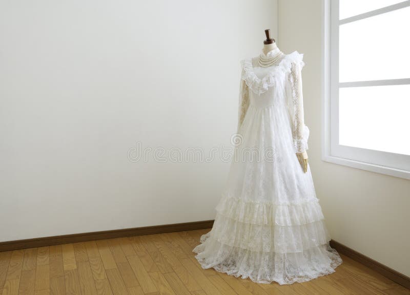 Wedding dress in white room.