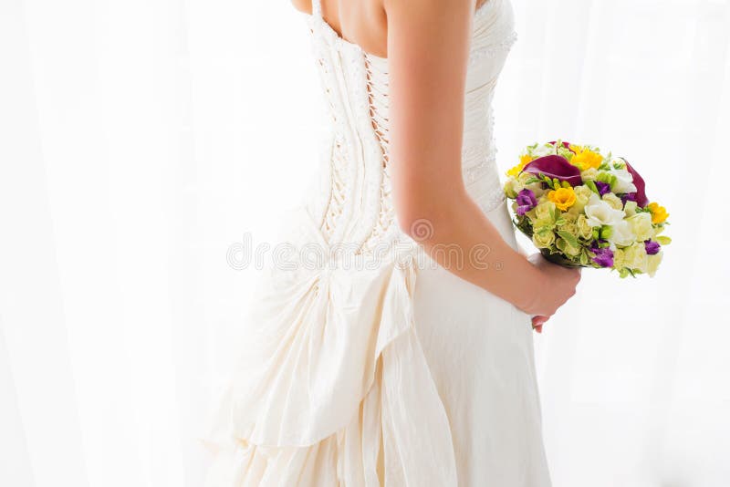 Wedding dress and bouquet stock image. Image of 61508843