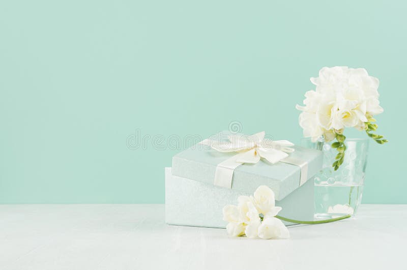 Wedding Festive Background with Gift Box, Fragrance Soft White Flowers  Freesia in Bouquet in Glass Vase in Green Mint Menthe. Stock Photo - Image  of anniversary, freshness: 176648706