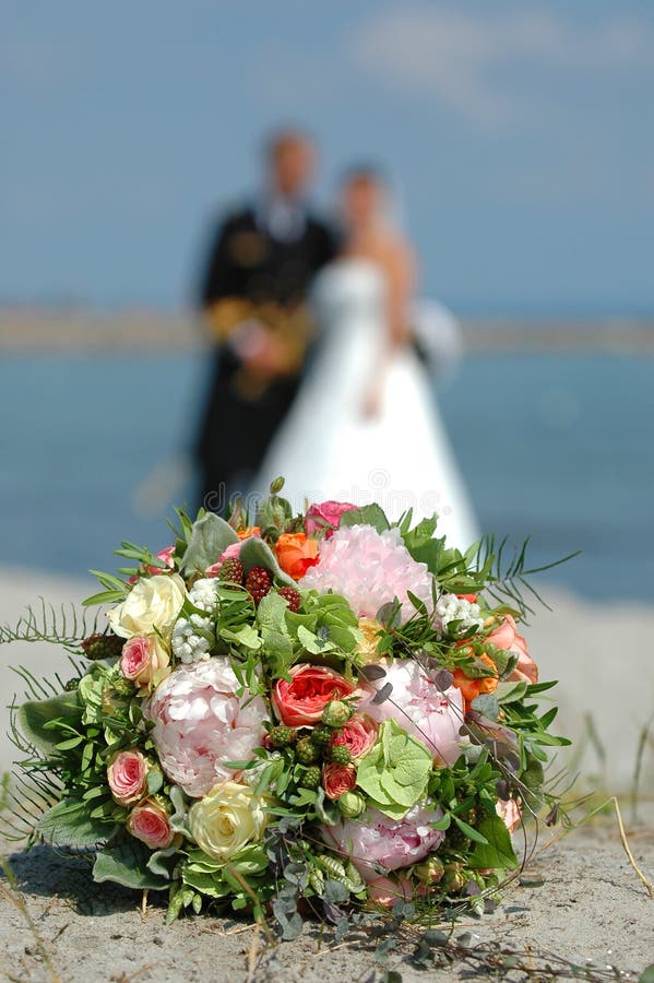 Wedding flowers and couple