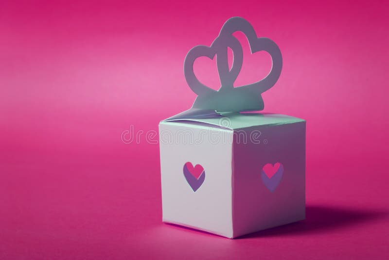 Wedding gift. Elegance romantic hearts-symbol on a pink background