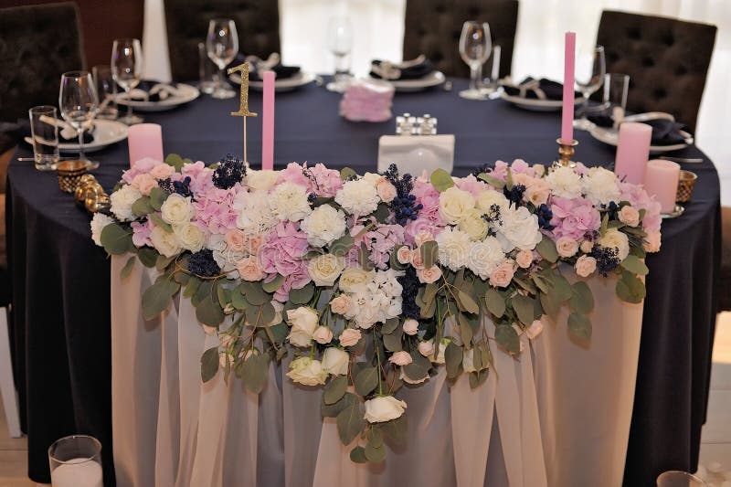 Wedding Guest Tables Decorated with Bouquet and Settings Stock Photo