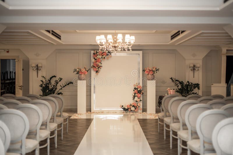 Wedding Hall. Rows of White Festive Chairs for Guests Stock Image