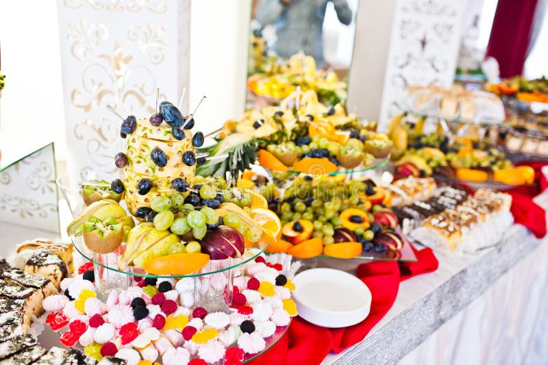 Wedding Reception Catering Table with Different Fruits and Cakes Stock ...