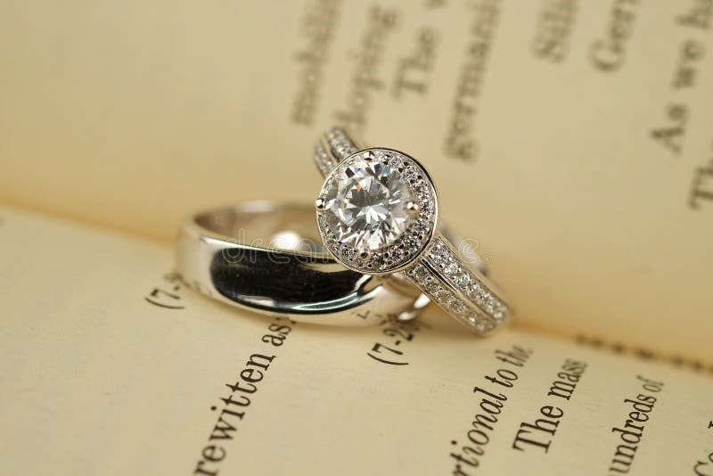 Wedding rings on book stock image. Image of event, bride 67452005