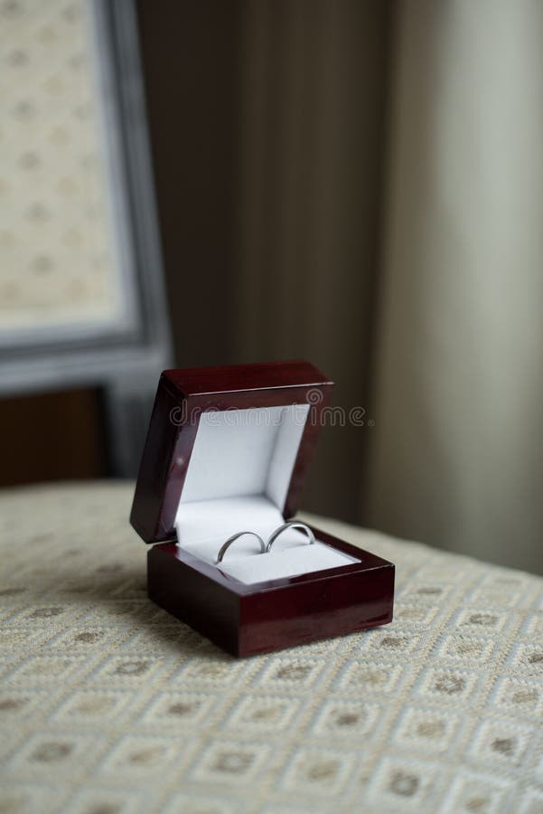 Wedding Rings in a Brown Box and a Crown Stock Photo Image of crown