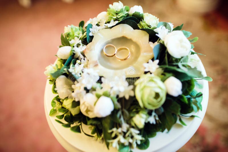 Wedding rings are in the candle among the flowers, wedding bouquet stock photography Wedding rings are in the candle among the flowers, wedding bouquet stock photography