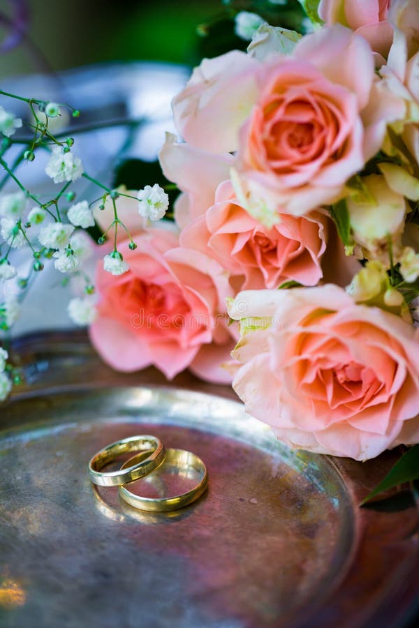Wedding Rings before the Ceremony, with Decorated Champagne Glasses and