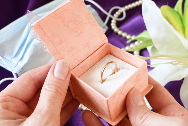 Wedding Rings in a Gift Box with Flowers and Pearl Necklace Stock Image