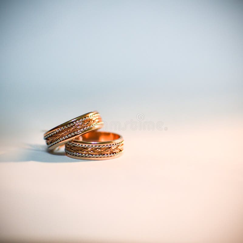 Wedding Rings for Couple Lover on the Sandy Beach. Engagement Rings in