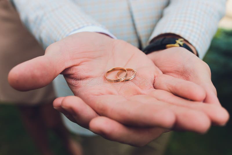 Wedding Rings in the Hand of the Groom. Stock Photo Image of
