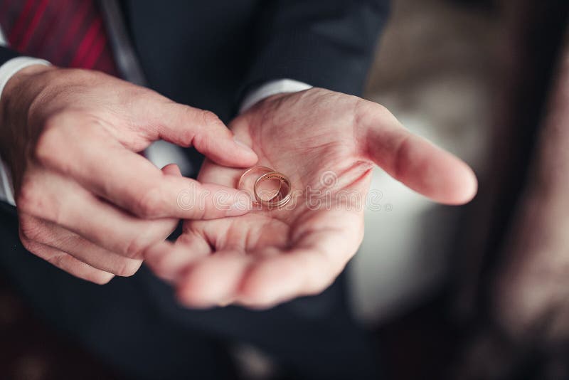 Wedding Rings in Hand of the Groom Stock Photo Image of finger, blur