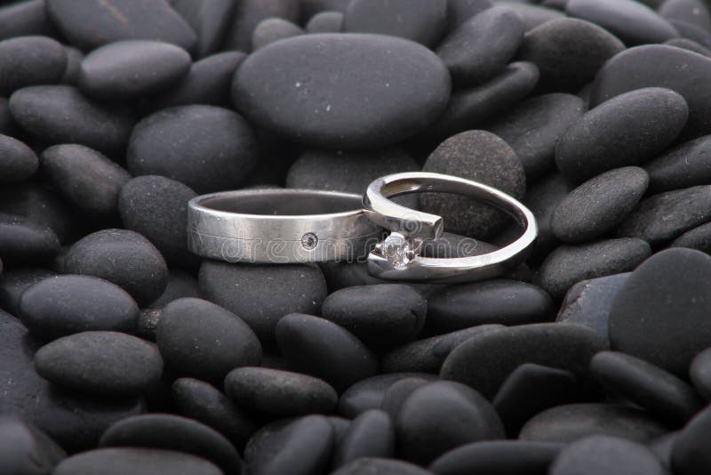 Wedding rings on pebbles royalty free stock photos