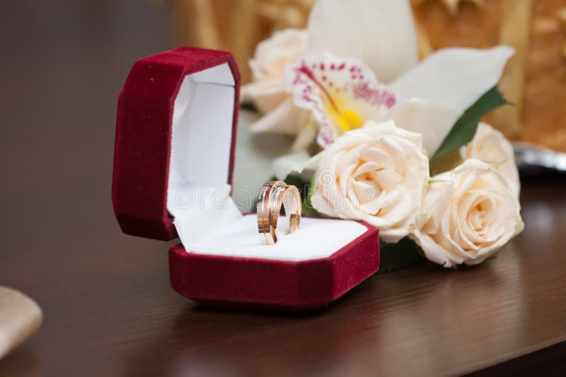 Wedding rings with roses stock image. Image of wooden - 61334717