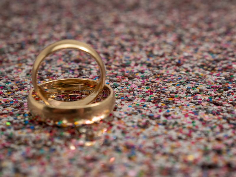 Wedding Rings on a Golden Shiny Background. Gold Rings Stock Image