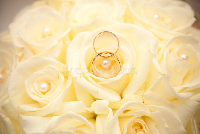 Wedding rings and wedding bouquet.