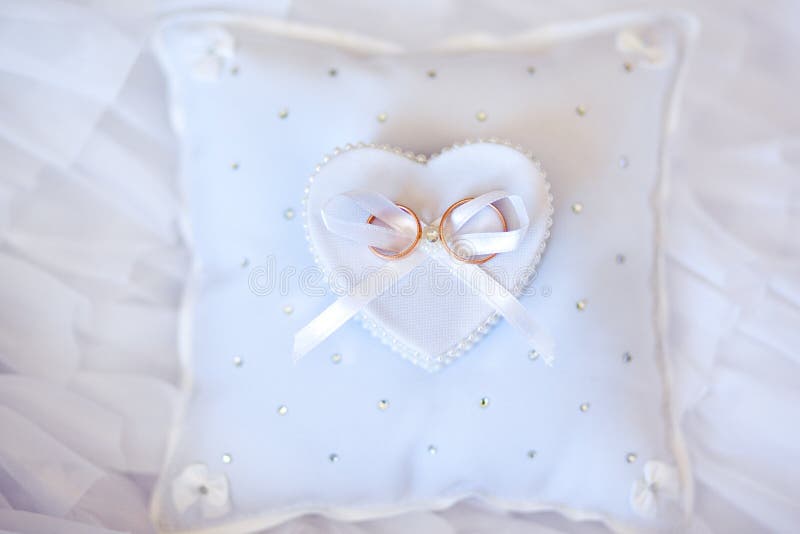 Wedding rings on the white pincushion