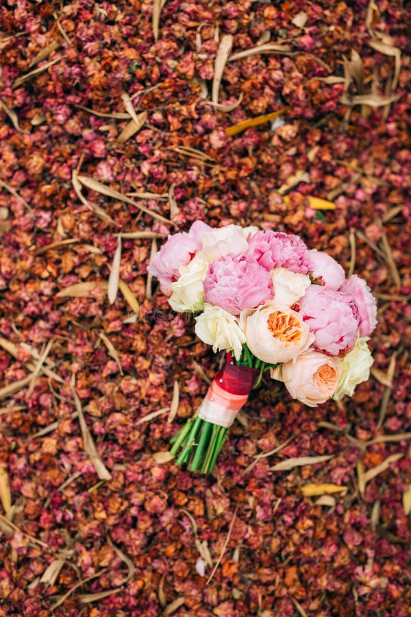 Wedding roses and peonies on dry red petals. Wedding in Monteneg