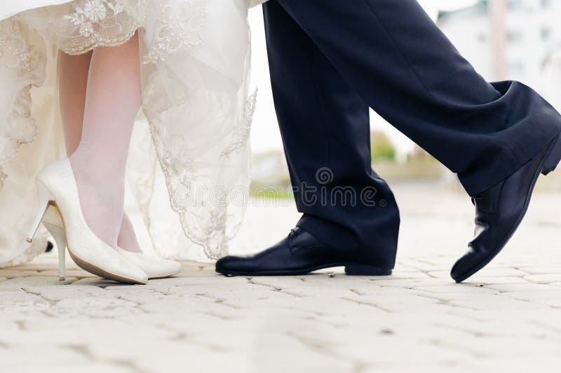Wedding shoes in a standing bride and groom