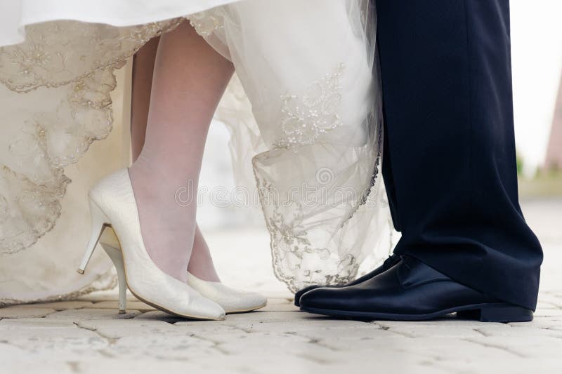 Wedding shoes in a standing bride and groom