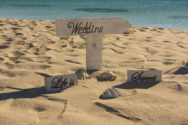 Wedding sign on a tropical beach paradise