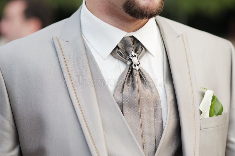 Elegant decoration on man wedding suit