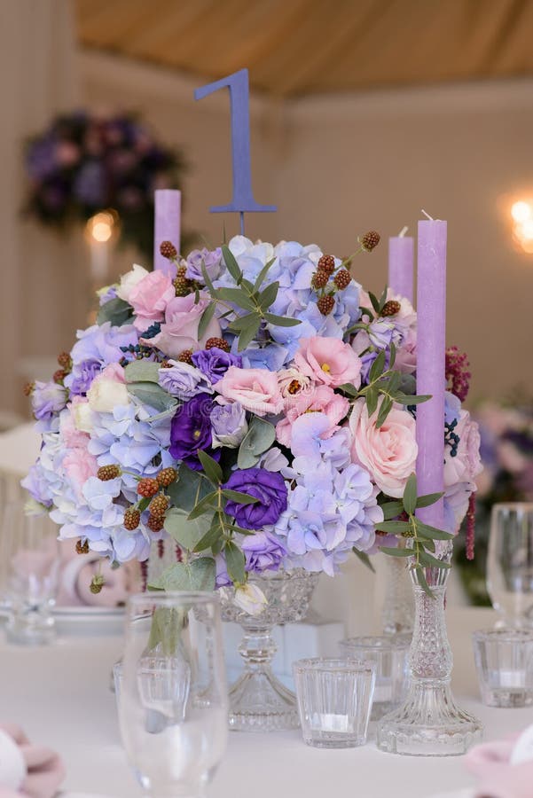 Wedding table decoration with violet, blue, pink flowers and greenery royalty free stock photos Wedding table decoration with violet, blue, pink flowers and greenery royalty free stock photos