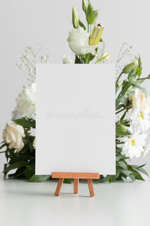 Wedding table number card mockup with a floral arrangement