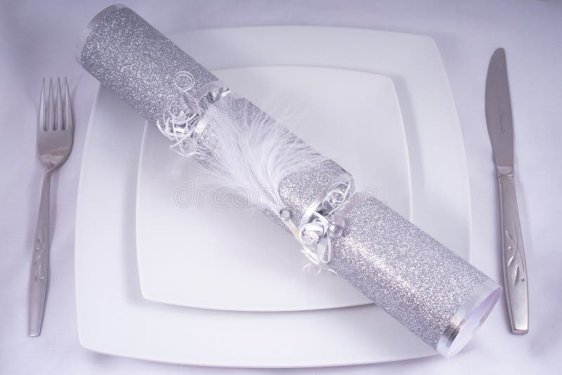 Wedding Table Place Setting with a Traditional Cracker stock photo
