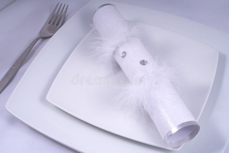 Wedding Table Place Setting with a Traditional Cracker royalty free stock images
