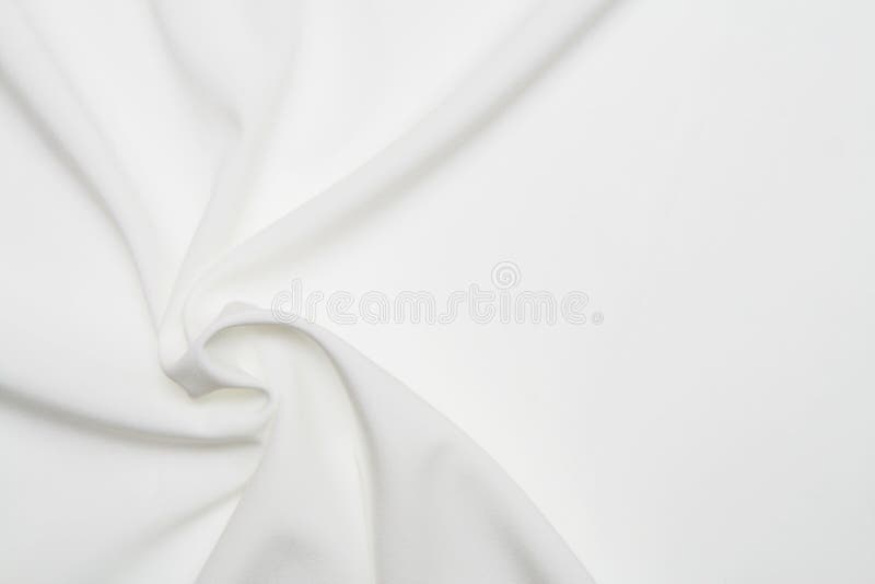 White silk background of the wedding dress. White silk background of the wedding dress