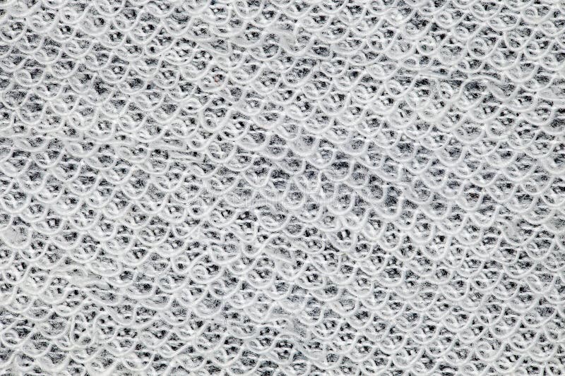 Fabric background of white threads sewn undularly close-up, background wallpaper, uniform texture pattern. Fabric background of white threads sewn undularly close-up, background wallpaper, uniform texture pattern.