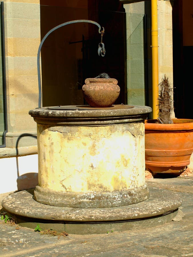 Weel and pots in ancient cloister