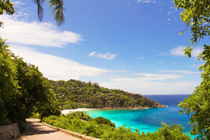 Road to the turquoise ocean and beach in the Seychelles. Road to the turquoise ocean and beach in the Seychelles
