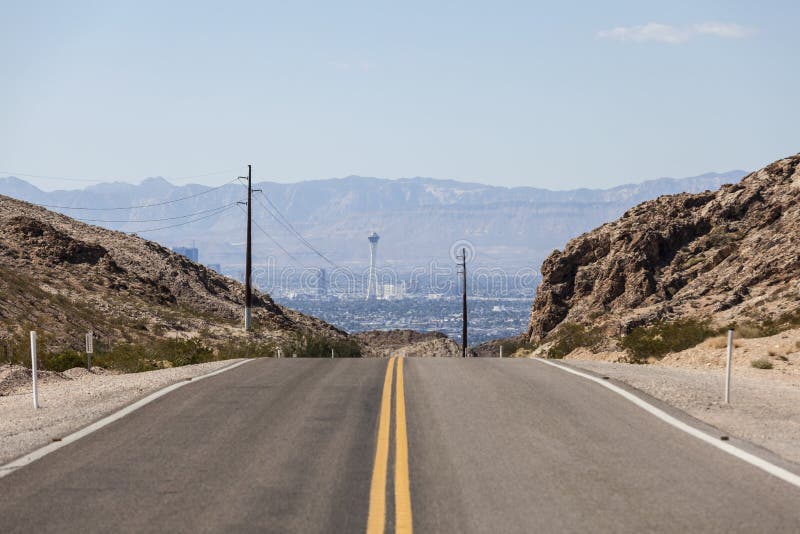 Desert road to the Stratosphere resort and the Las Vegas strip. Desert road to the Stratosphere resort and the Las Vegas strip.