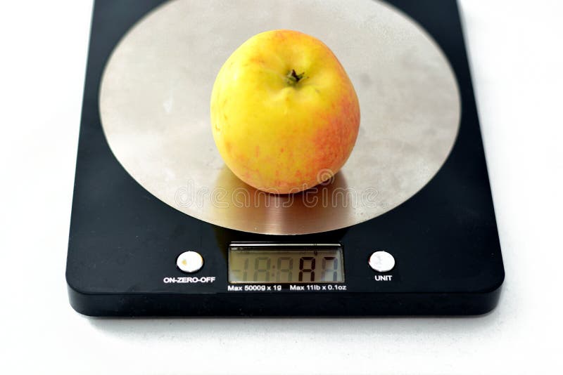 Weighing an Apple Fruit on a Digital Kitchen Scale in Grams Isolated on  White Background, Healthy Food, Weight Loss Concept Stock Image - Image of  calories, closeup: 245258739