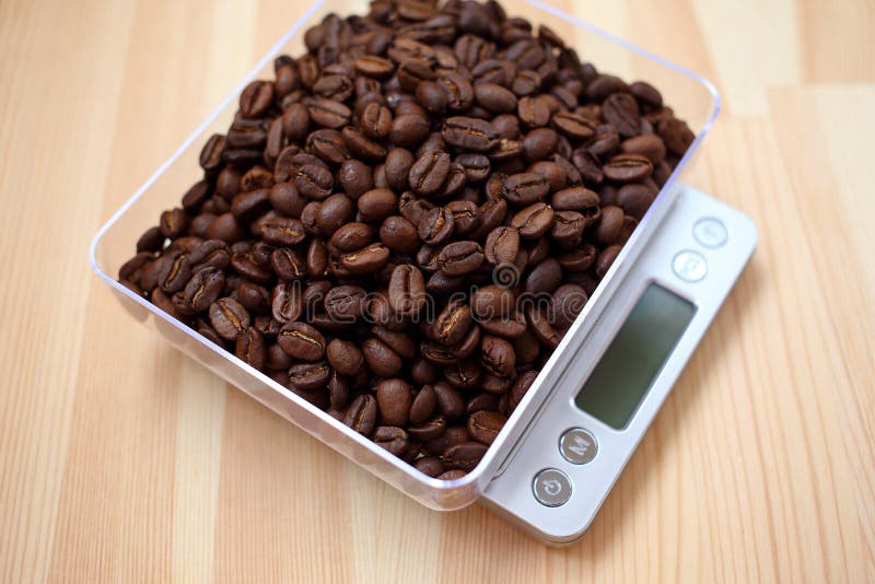 Coffee Beans On A Balance Scale. Stock Photo, Picture and Royalty