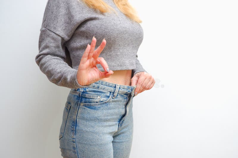 Impressive Result. Girl Shows Big Size of Her Pants and Slim Belly. Slim  Fit Woman Denim Pants Stock Photo - Image of burning, attractive: 183641834