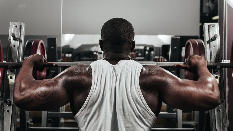 Weight training African doing bodybuilding stock photo Weight training African doing bodybuilding stock photo