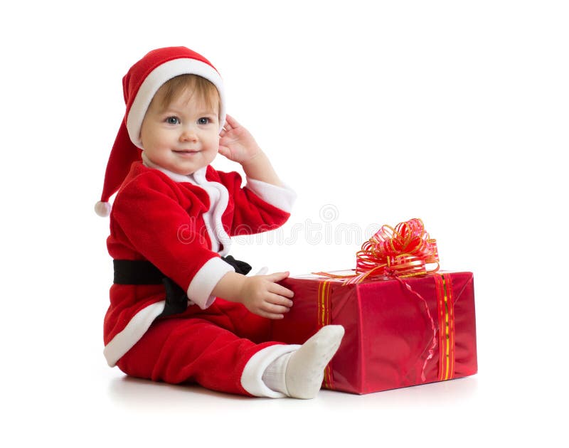 Weihnachtsbaby mit Kasten in Sankt Kleidung lizenzfreie stockbilder Weihnachtsbaby mit Kasten in Sankt Kleidung lizenzfreie stockbilder