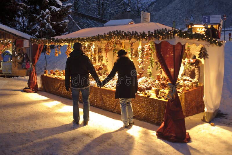 ETTAL, BAVARIA, GERMANY - DECEMBER 4: The traditional annual christmas market with illuminated shops at night in famous 700 years old benedictine abbey Ettal, nearby city Oberammergau and Garmisch, December 4, 2010 in Ettal, Germany. ETTAL, BAVARIA, GERMANY - DECEMBER 4: The traditional annual christmas market with illuminated shops at night in famous 700 years old benedictine abbey Ettal, nearby city Oberammergau and Garmisch, December 4, 2010 in Ettal, Germany