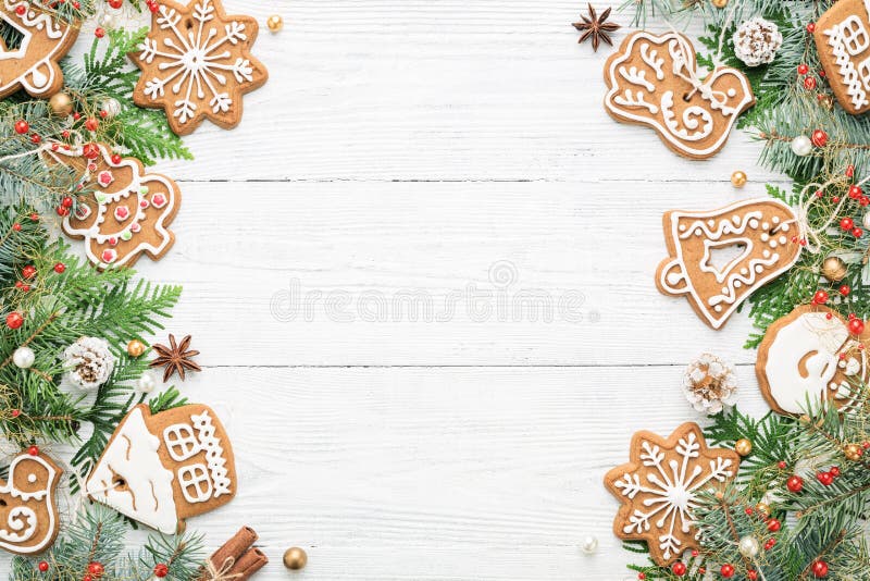 Weihnachtsrahmen mit rustikalen Verzierungen und Lebkuchenplätzchen an lizenzfreie stockfotos Weihnachtsrahmen mit rustikalen Verzierungen und Lebkuchenplätzchen an lizenzfreie stockfotos