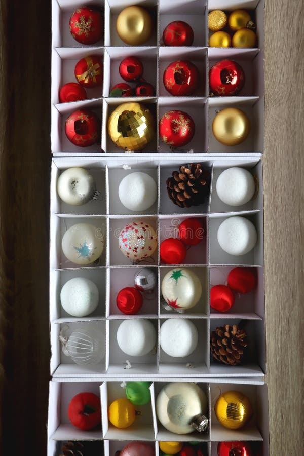 Boxes with various organized Christmas ornaments. Decorating or taking down the Christmas tree. Top view. Boxes with various organized Christmas ornaments. Decorating or taking down the Christmas tree. Top view.