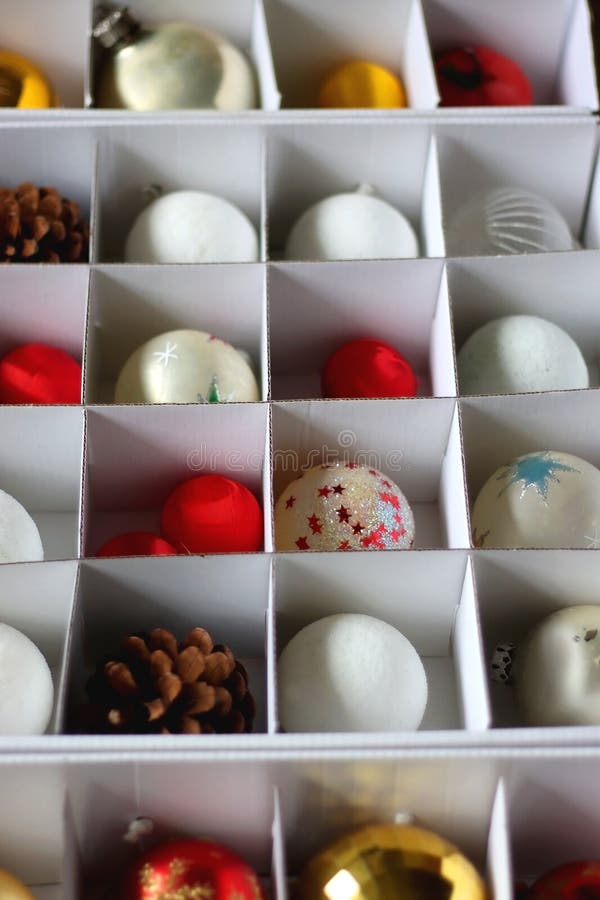 Boxes with various organized Christmas ornaments. Decorating or taking down the Christmas tree. Selective focus. Boxes with various organized Christmas ornaments. Decorating or taking down the Christmas tree. Selective focus.