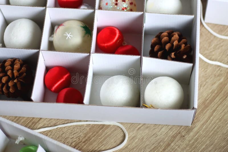 Boxes with various organized Christmas ornaments. Decorating or taking down the Christmas tree. Selective focus. Boxes with various organized Christmas ornaments. Decorating or taking down the Christmas tree. Selective focus.