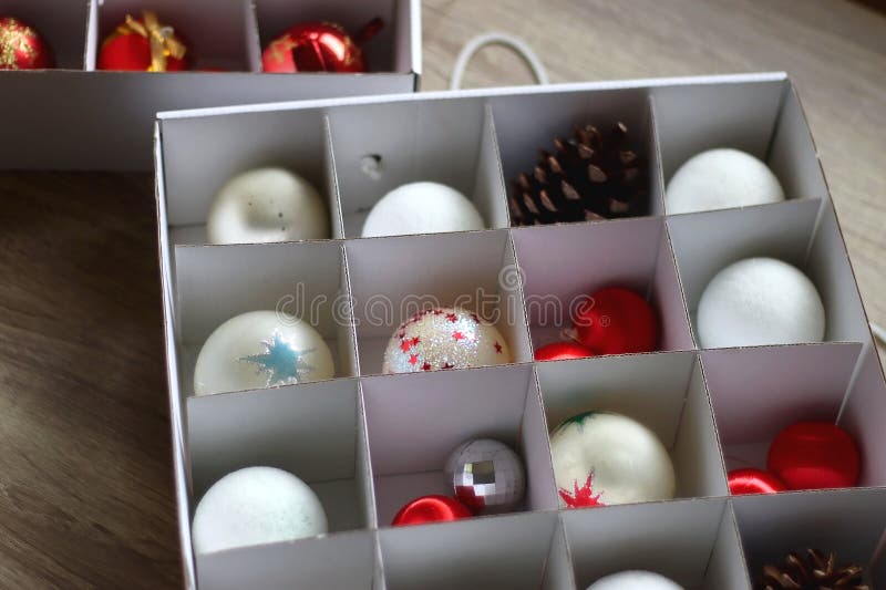 Boxes with various organized Christmas ornaments. Decorating or taking down the Christmas tree. Selective focus. Boxes with various organized Christmas ornaments. Decorating or taking down the Christmas tree. Selective focus.